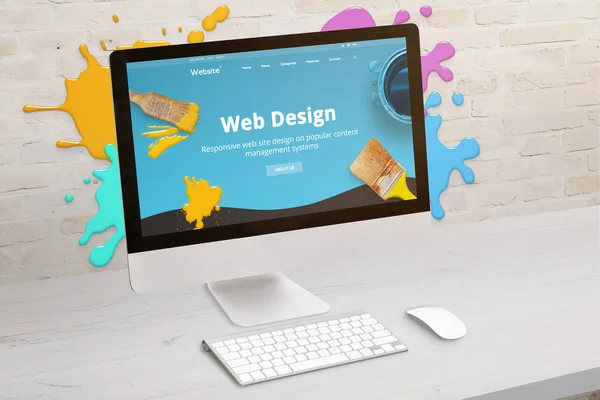 Concept of web design studio with coimputer display and color drops on brick wall. Modern web design teme on screen. Concept of modern graphic studio desk.