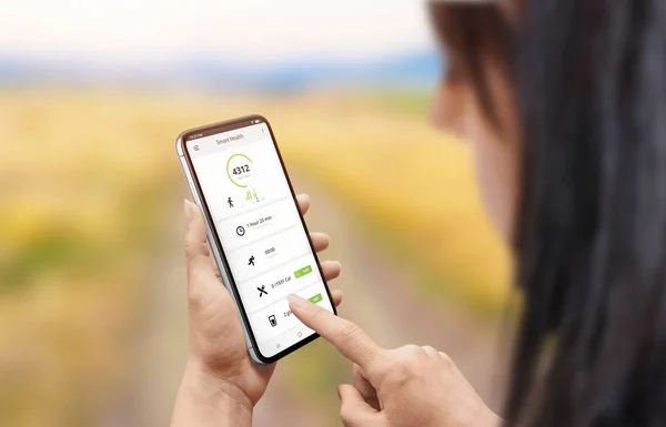 Smart health app on smart phone in woman hand.