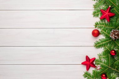Christmas New Year decorations on white wooden table with free space for greeting text