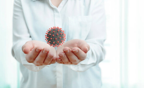 Медсестра показала вирион коронного вируса. концепция вирусных и эпидемических исследований. 