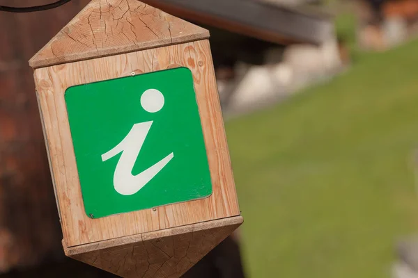 info point green wooden lantern in Val di Funes