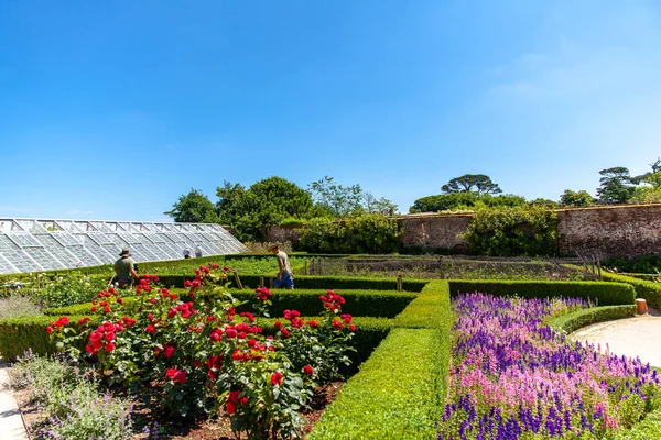 gardener in the landscaping at the Lost Gardens of Heligan attractions Cornwall England