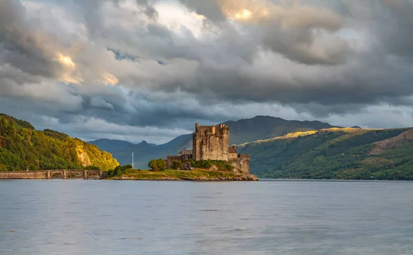 Eilean Donan Castle with cloudy sunset sky  Highlands Scotland Landscape Travel Great Britan