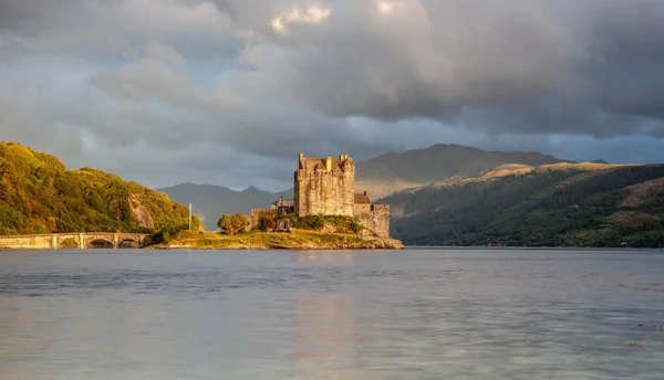 Eilean Donan Castle with cloudy sunset sky  Highlands Scotland Landscape Travel Great Britan