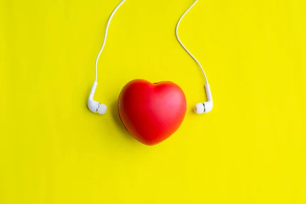 red heart with earphone, sound of love, soft focus.