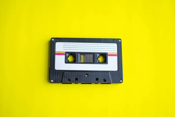 Retro of tape cassette on yellow background. soft focus. — Stock Photo, Image