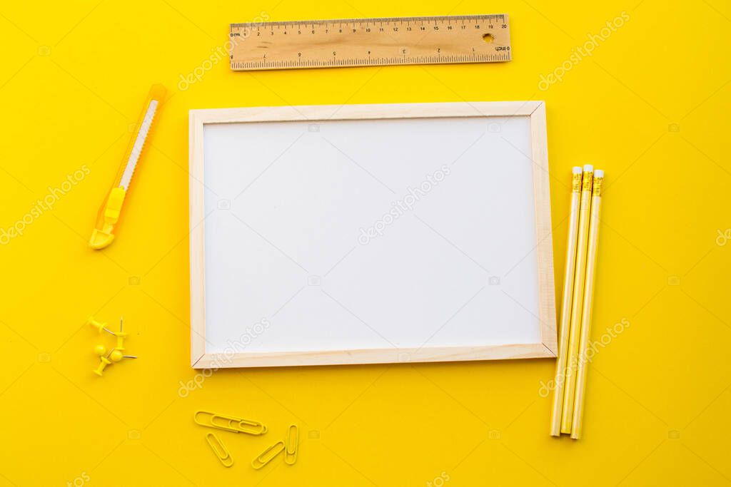 white copy space on yellow background with pencil and school concept.