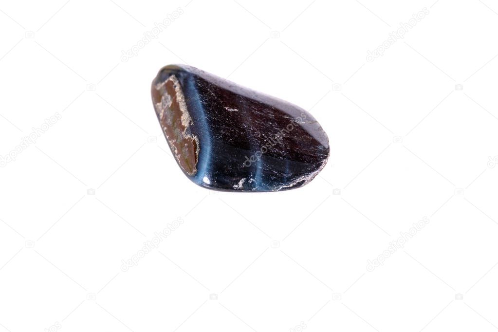 Macro mineral stone Falcon eye on a white background close up