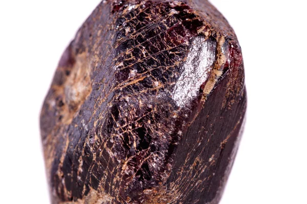 Macro of a mineral garnet stone on a white background close up