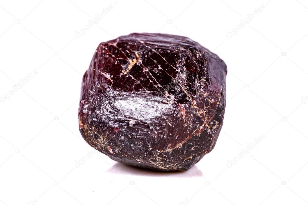 Macro of a mineral garnet stone on a white background close up