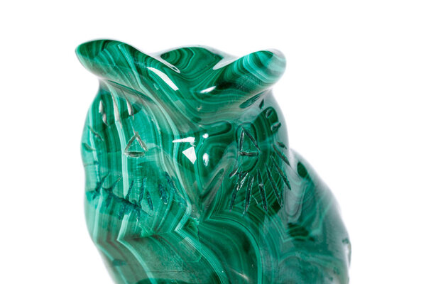 macro mineral stone owl from malachite close-up
