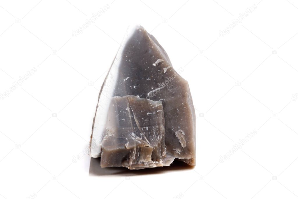 Macro mineral stone Flint in the rock on a white background close up