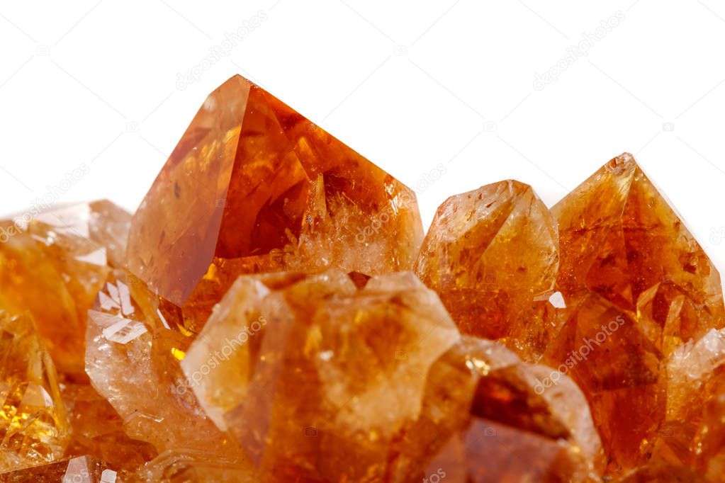 Macro mineral stone Citrine in rock in crystals on a white background close up