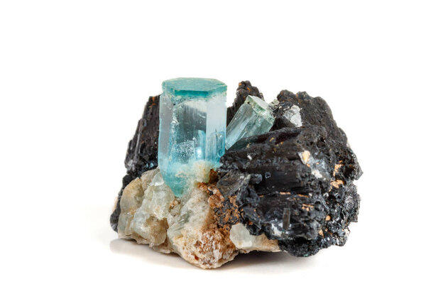Macro mineral stone Aquamarine and black tourmaline, Schorl on a white background close up