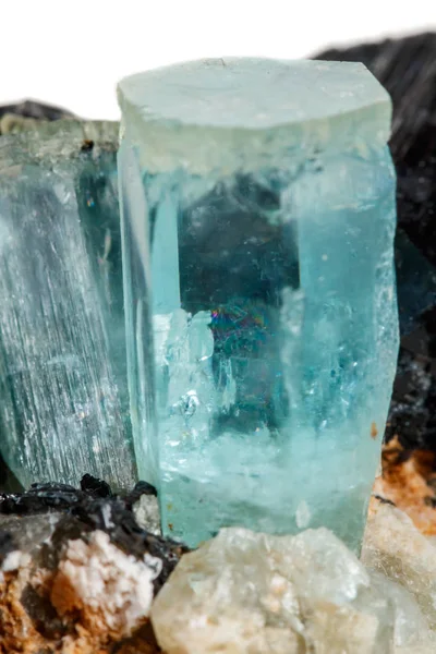 Macro mineral stone Aquamarine and black tourmaline, Schorl on a white background close up