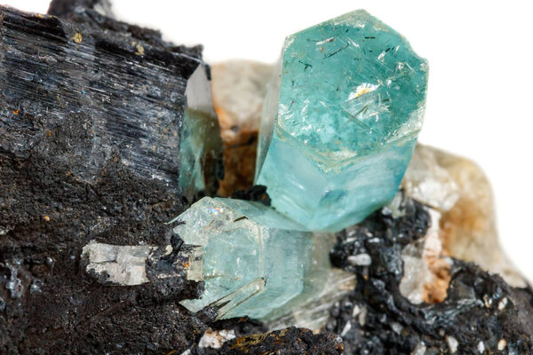 Macro mineral stone Aquamarine and black tourmaline, Schorl on a white background close up