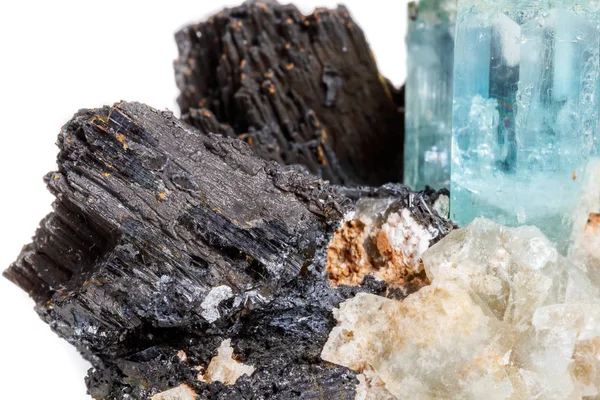 Macro mineral stone Aquamarine and black tourmaline, Schorl on a white background close up