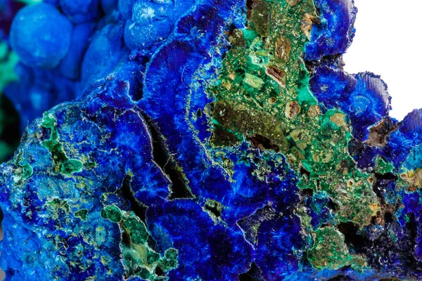 Macro mineral stone malachite with azurite on white background close up