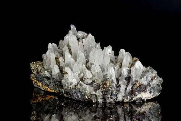 Macro mineral stone Galena, Sphalerite, Pyrite, Quartz on a black background close-up