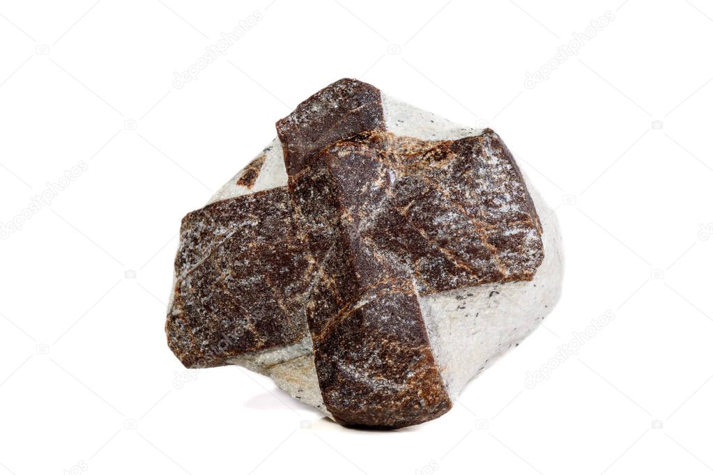 Macro mineral stone Staurolite on a white background close up