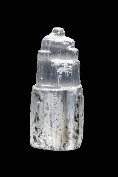 Macro mineral stone Selenite Gypsum on a black background close up
