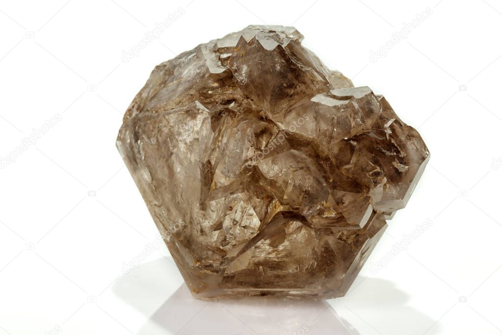 Macro mineral stone smoky quartz, rauchtopaz on a white backgrou