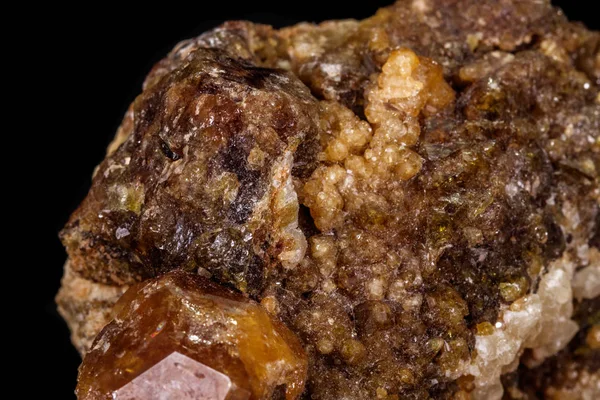 macro mineral stone Grossular, Garnet, Epidote on a black backgr