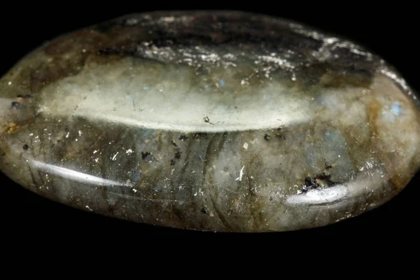 Macro of the stone Labradorite mineral on a black background — Stock Photo, Image