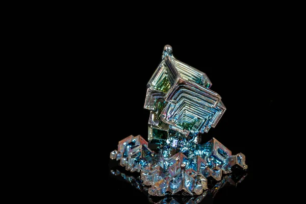 Macro of the stone bismuth mineral on a black background — Stock Photo, Image