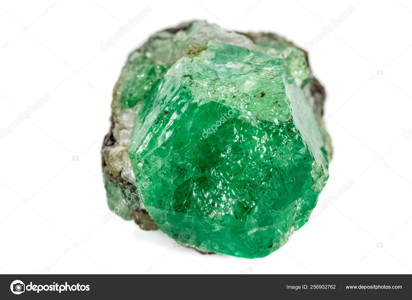 Macro stone garnet mineral, Uvarovite in rock on a white backgro