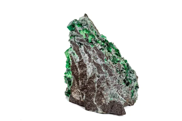 Macro stone garnet mineral, Uvarovite in rock on a white backgro — Stock Photo, Image