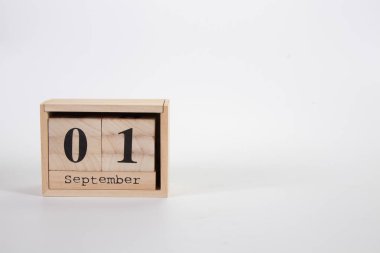 Wooden calendar September 01 on a white background 