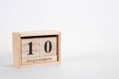 Wooden calendar September 10 on a white background 