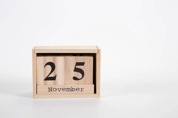 Holzkalender 25. November auf weißem Hintergrund — Stockfoto