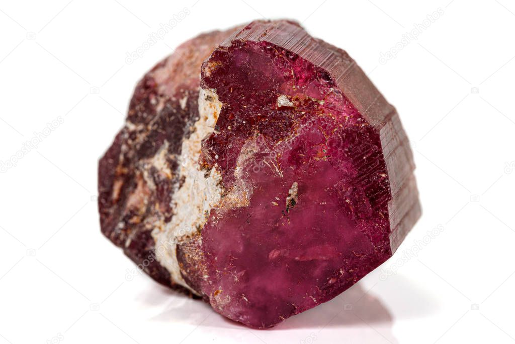 Macro red tourmaline mineral stone on white background