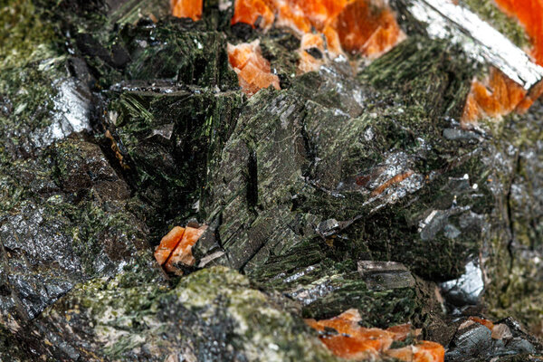 Macro stone mineral Diopside Calcite Magnetite on a white backgr