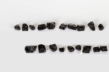 macro mineral stone schorl, black tourmaline on white background clipart
