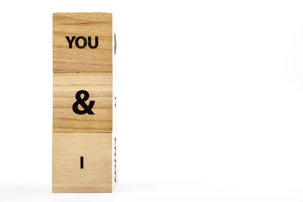 Wooden cubes with the inscription you & i on a white background — Stock Photo, Image
