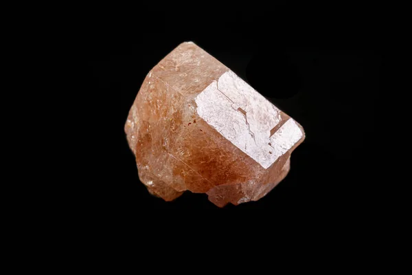 macro mineral garnet stone on a black background
