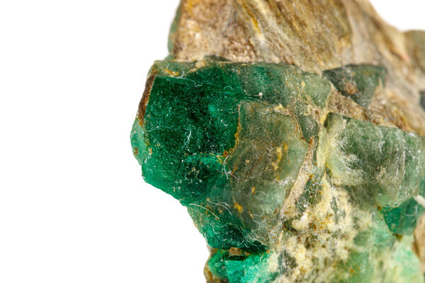 macro stone mineral emerald on a white background close-up