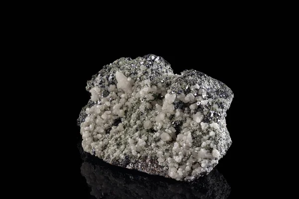 macro stone mineral Quartz Calcite Sphalerite Galena on a black background close-up
