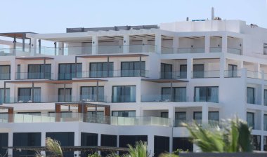 modern resort villas with palm trees and greenery