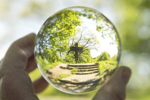 memorial cross through glass ball, selective focus