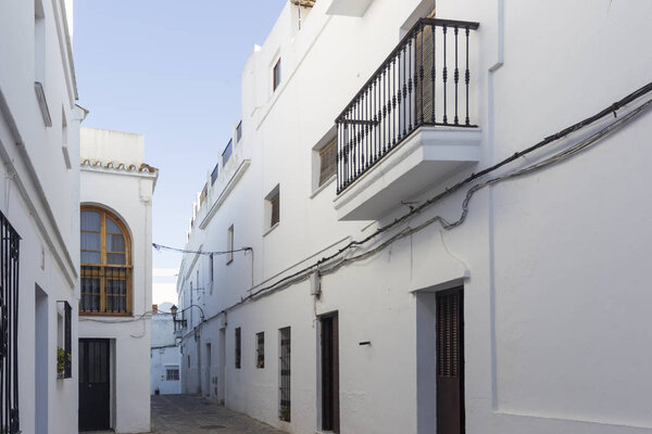 Facades of houses in white village Vejer de la Frontera in Andalusia