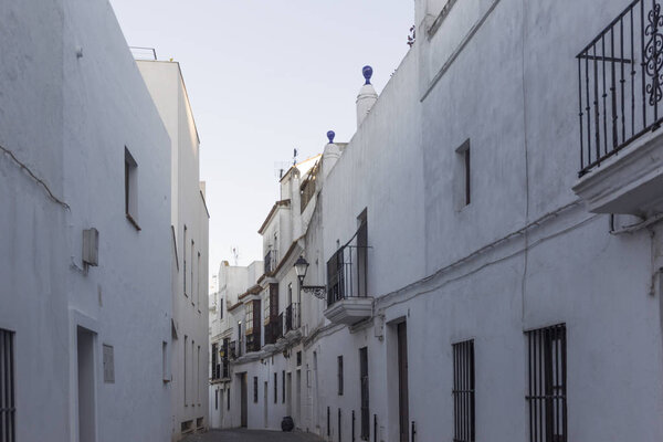 Facades of houses in white village Vejer de la Frontera in Andalusia