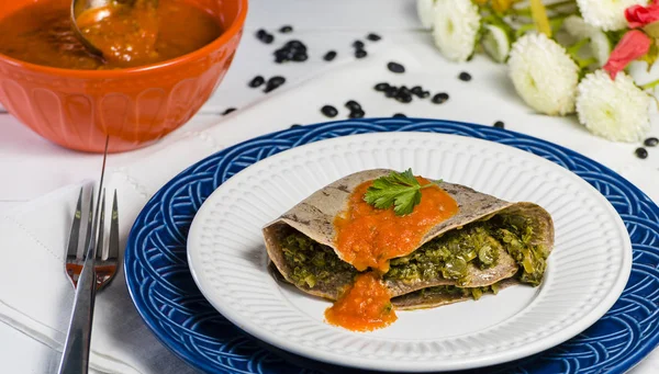 Bean crepe stuffed with stems and leaves - vegetarian