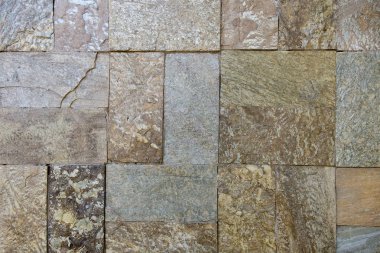 Arka plan ya da doku olarak taş duvar. Bir dış duvar kaplaması olarak duvarcılığa bir örnek.