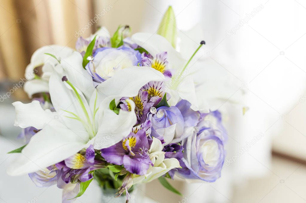 Rose and Lily in a brides flower bouquet, wedding.