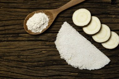 Beiju of tapioca, cassava-based dish typical of the northeastern region of Brazil, now consumed in the whole country on old wooden background.