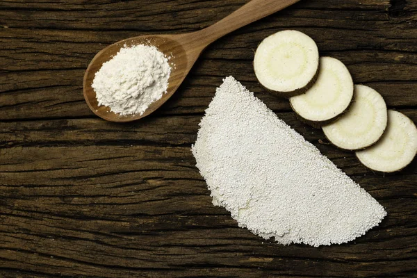 Beiju of tapioca, cassava-based dish typical of the northeastern region of Brazil, now consumed in the whole country on old wooden background.